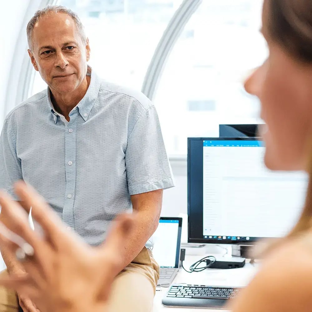 CEDR-Professionals-in-discussion-with-a-window-behind