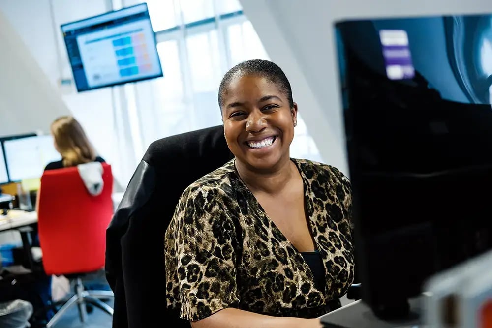 CEDR-Telephone-Support-Office-Lady-smiles-for-camera