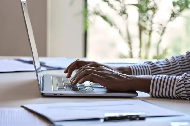 young-african-black-female-hands-typing-on-laptop