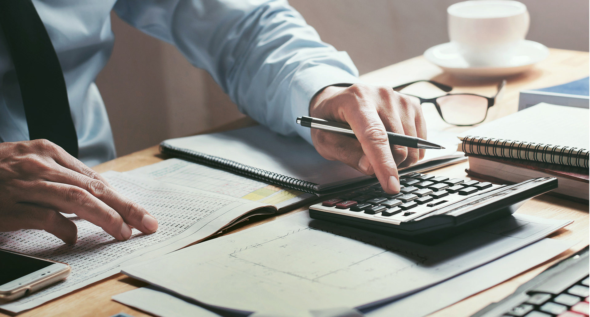 Man using calculator