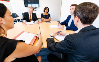 Mock mediation with five people around a table