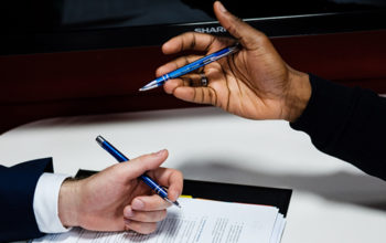 Hands with paper and pen